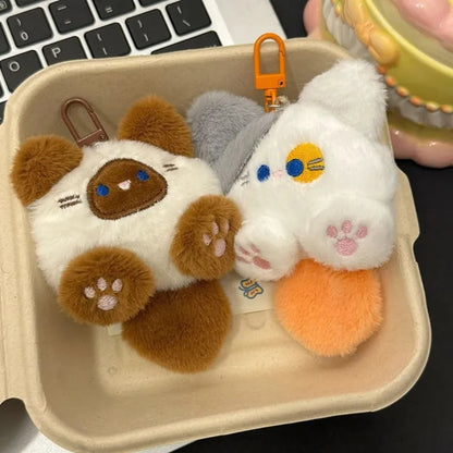 Cat plush keychains with brown, white, gray cats and dangling metal key rings