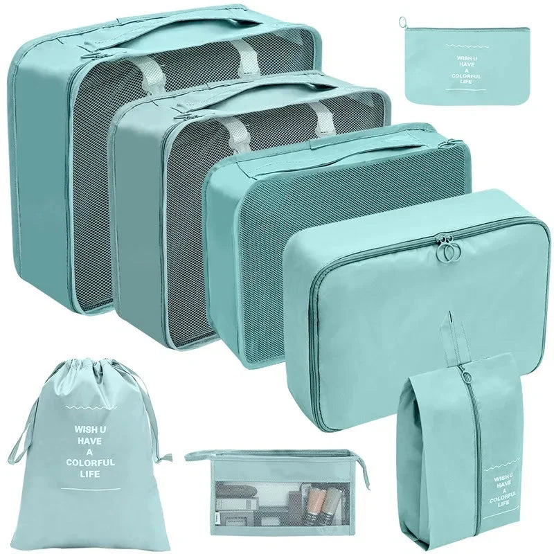 Light teal travel packing organizer cubes set with mesh tops and matching zip pouches