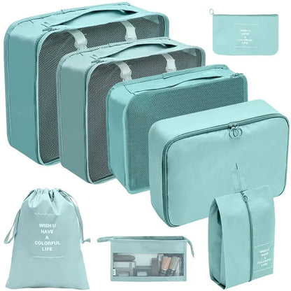Light teal travel packing organizer cubes set with mesh tops and matching zip pouches