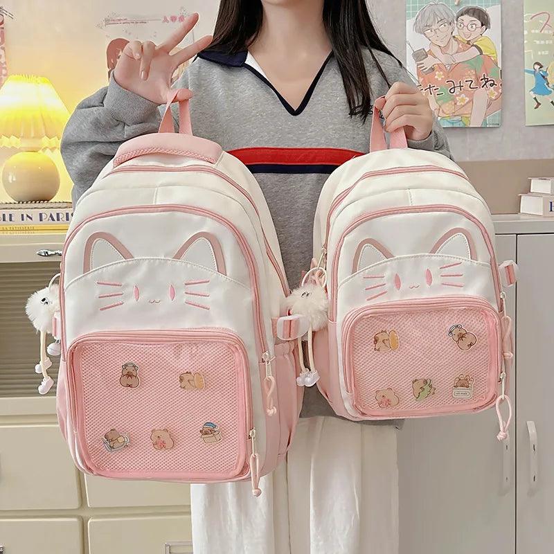 Pink and white cat-face school backpack with mesh front pocket and side zippers