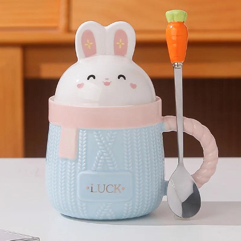 Blue bunny ceramic mug with rabbit lid, textured body, and 'LUCK' text.