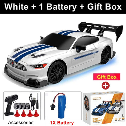 White RC drift racing car with blue stripes and black rear wing, 4x4 off-road style