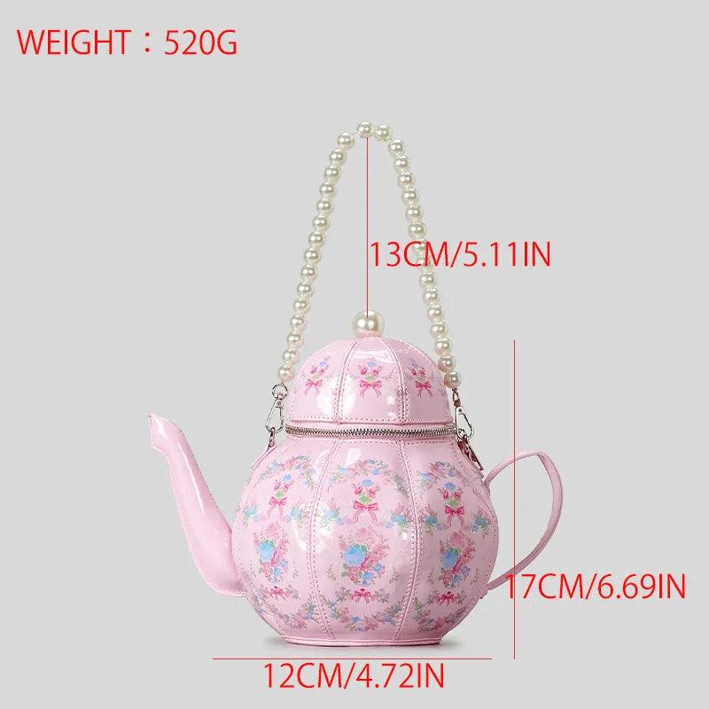 Pink teapot-shaped mini bag with floral print and pearl beaded shoulder handle