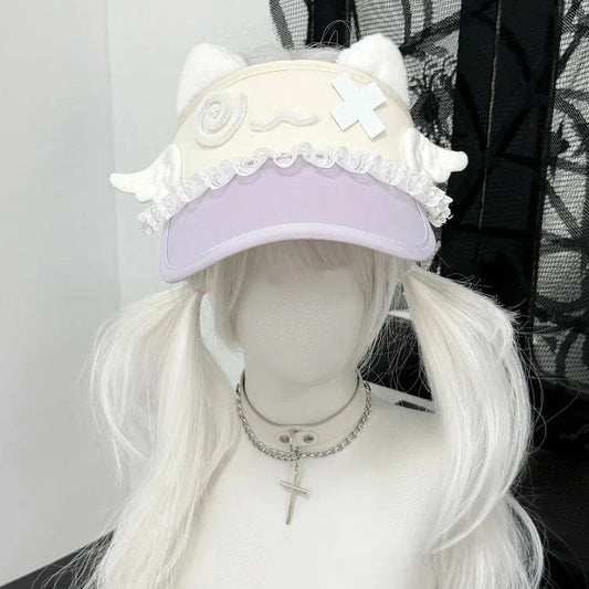 Pink cat-ear visor with lace ruffle trim and kitty crossbones style patch