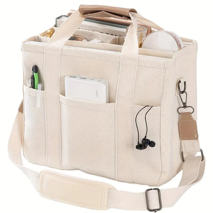 Beige canvas multi-pocket tote bag with adjustable shoulder strap and side key clip