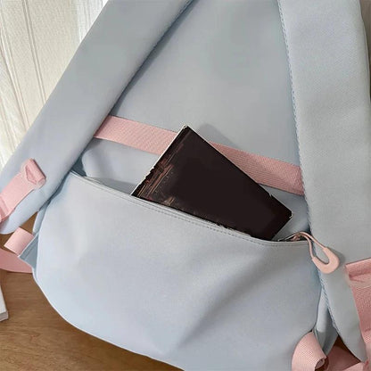 Pastel backpack front opening with inner pocket holding a small card case