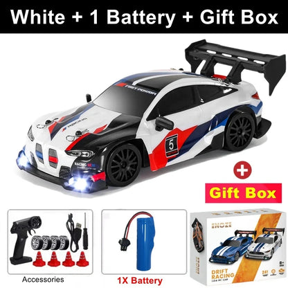 White RC drift racing car with blue and red detailing, black rear wing, 4x4 style