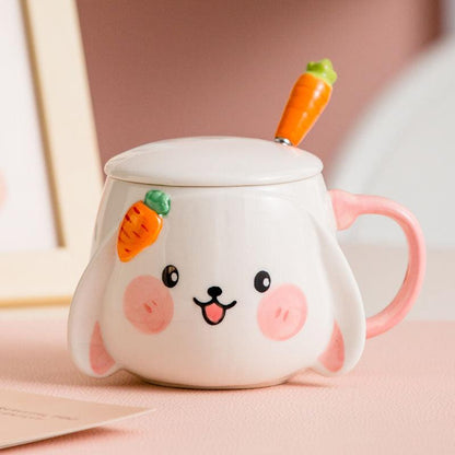 Rabbit ceramic mug with lid and carrot spoon, pink handle, bunny face on the front.