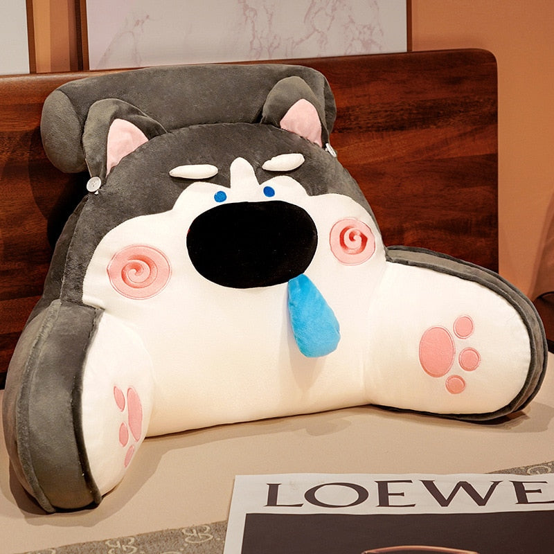 Gray animal reading pillow shaped like a dog, with large black snout and paw accents