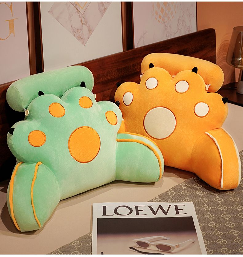 Pair of cat-paw reading pillows in mint green and orange with round face details