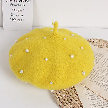 Yellow felt beret with faux pearl embellishments and a small center stem