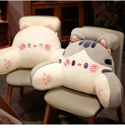 Cat reading pillows on chairs: cream body and grey hood with swirl faces and paw prints
