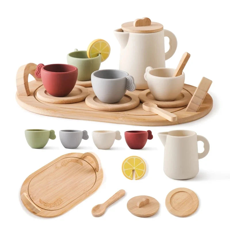 Wooden pretend tea set with teapot, cups, tray, lemon slices, and wooden spoon