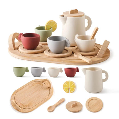 Wooden pretend tea set with teapot, cups, tray, lemon slices, and wooden spoon
