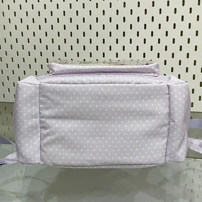 Light purple polka dot backpack back view with padded panel and folded top handle