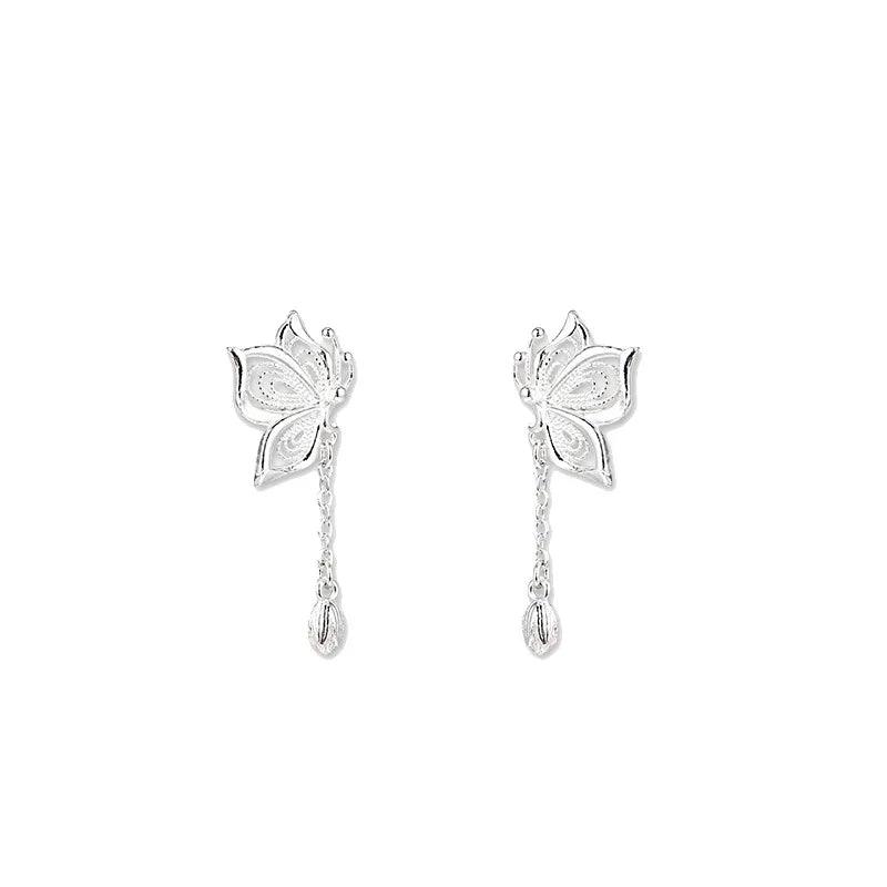 Pair of silver butterfly stud earrings with long chains and teardrop charms
