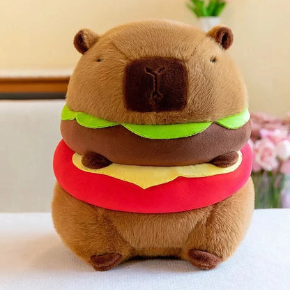 Brown capybara plush in burger costume with green and red layers
