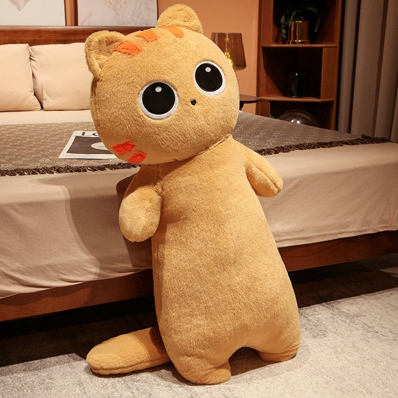 Tan cat plush body pillow with big round eyes and small embroidered nose