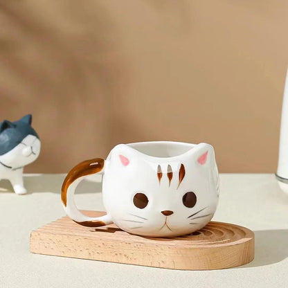 Cat ceramic mug, white with brown ear and face spots, on wooden base