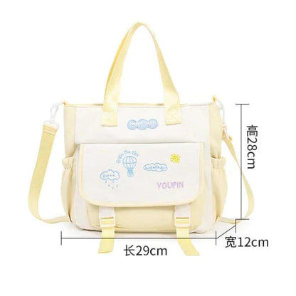 Kids tote bag in cream with front pocket and yellow strap, part of backpack set