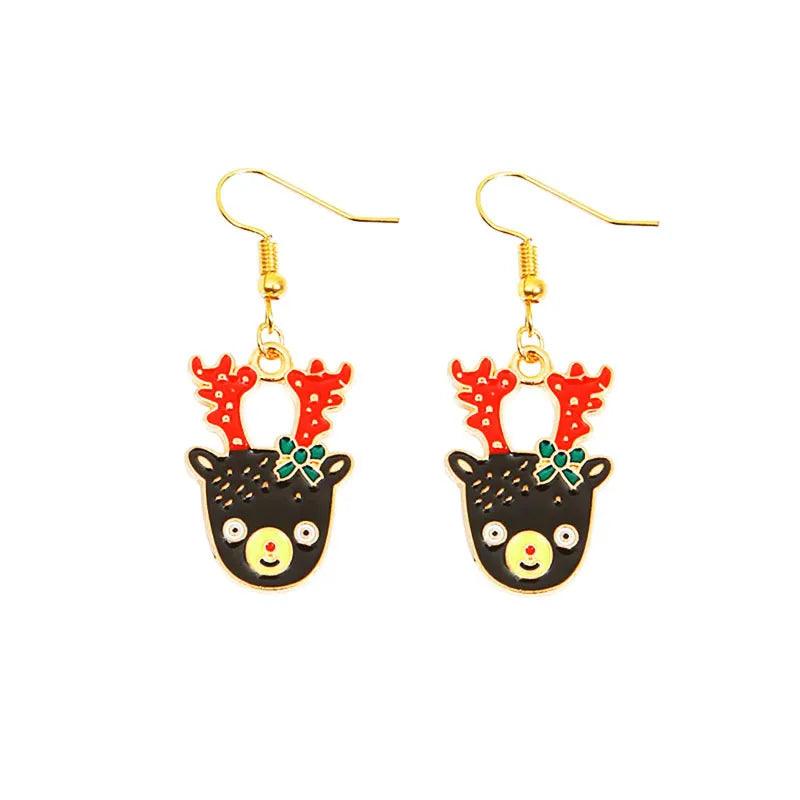 Gold drop earrings with cartoon deer face, red antlers, green bow, black details