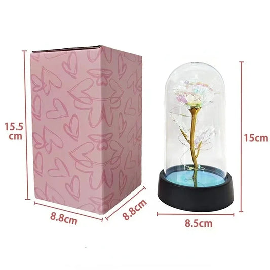 LED artificial rose in clear glass dome with gold stem and black round base