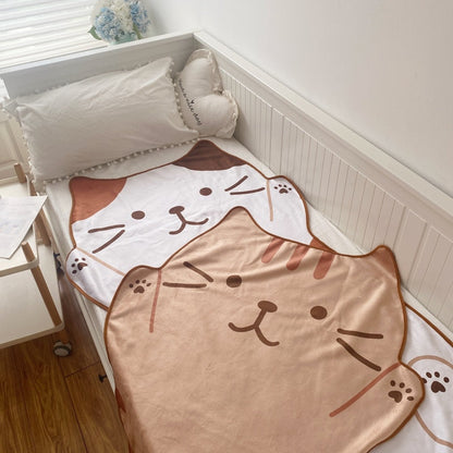 Cat flannel blanket with white and tan cat faces, rounded edge design