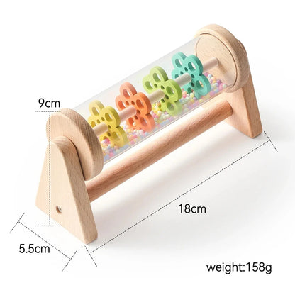 Wooden rain stick sensory toy with clear cylinder, colorful beads, and side measurements