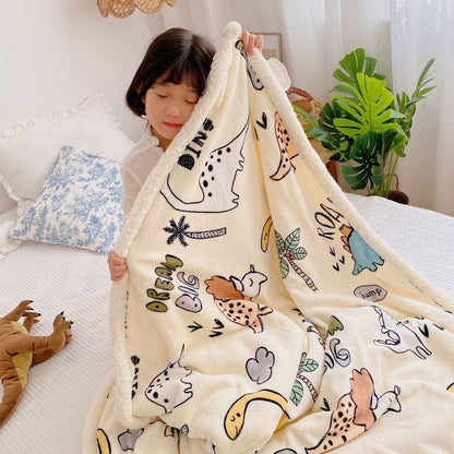 Lamb fleece blanket with cream dinosaur and animal print and sherpa hood edge