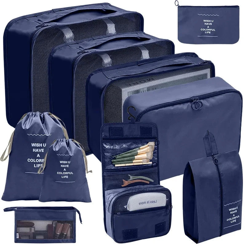 Dark blue packing cubes set with mesh panels and zippered organizer pouches for travel.