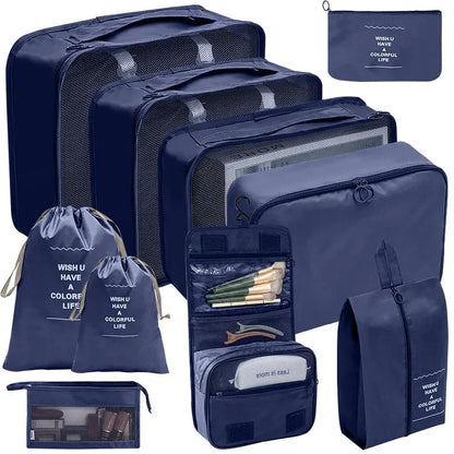 Dark blue packing cubes set with mesh panels and zippered organizer pouches for travel.