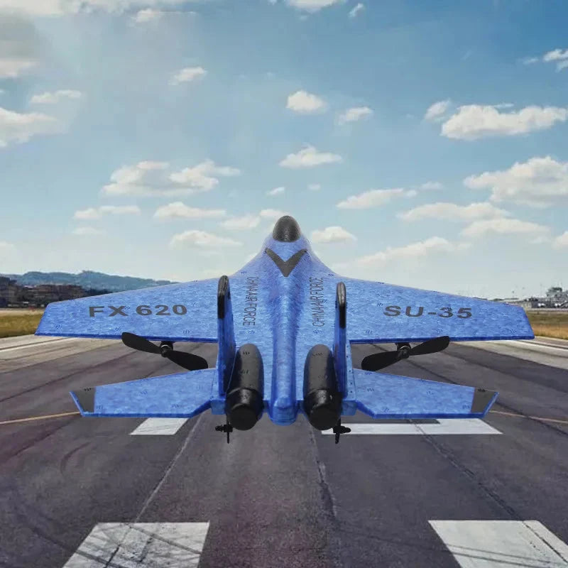 Blue RC foam fighter glider SU-35 on runway, rear view