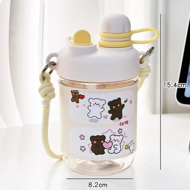 Pink animal-themed water bottle with straw, carry strap, and cartoon bear designs