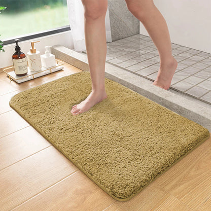 Beige long-pile absorbent bathroom mat with non-slip backing, rectangular