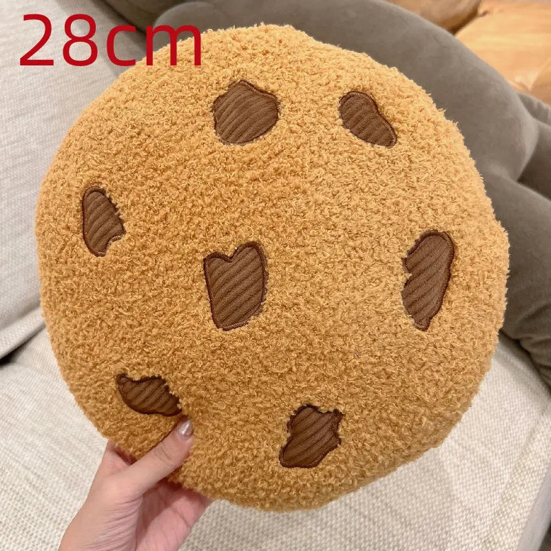 Tan round cookie plush pillow, 28cm, with brown stitched chocolate-chip shapes