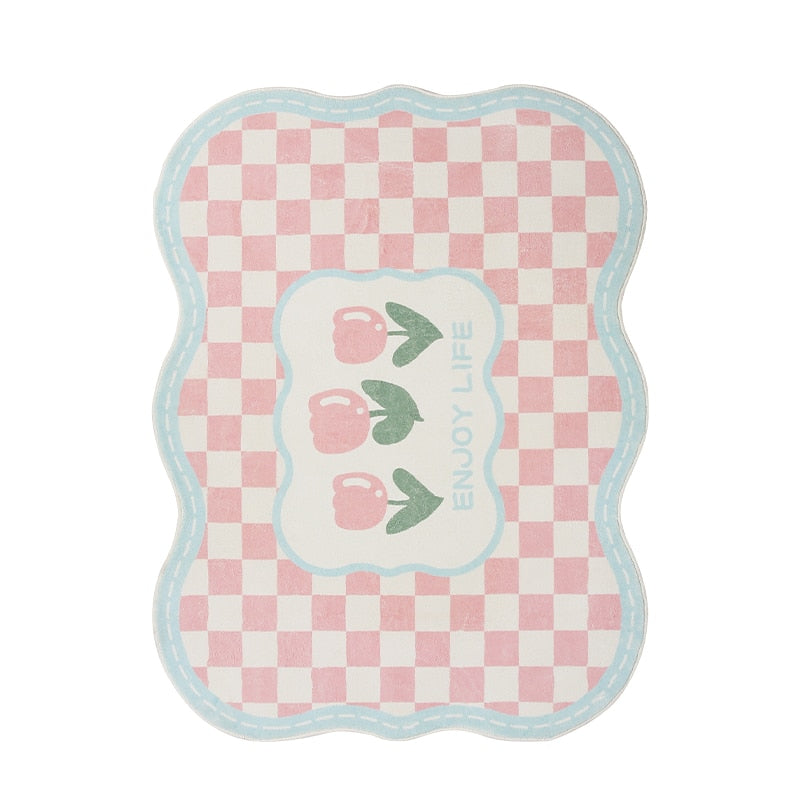 Pink gingham area rug with tulip graphic, blue border, scalloped shape