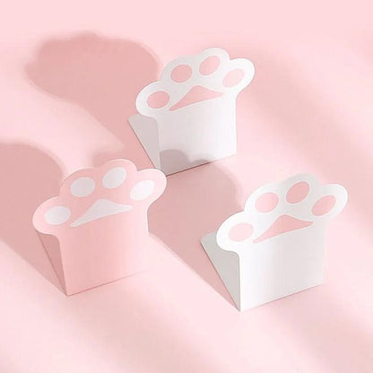Cat paw bookends set, white paw shapes on pink backing, three-piece arrangement