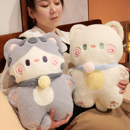 Grey and cream cat-shaped plush pillow with swirl face and rounded ears