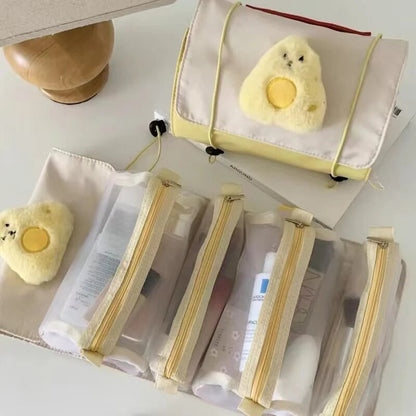 Roll-up makeup bag with chick face patch and four zip pouches, yellow-trimmed white fabric