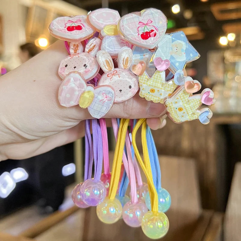 Pastel elastic hair ties with bunny, heart, and charm beads on colorful strings