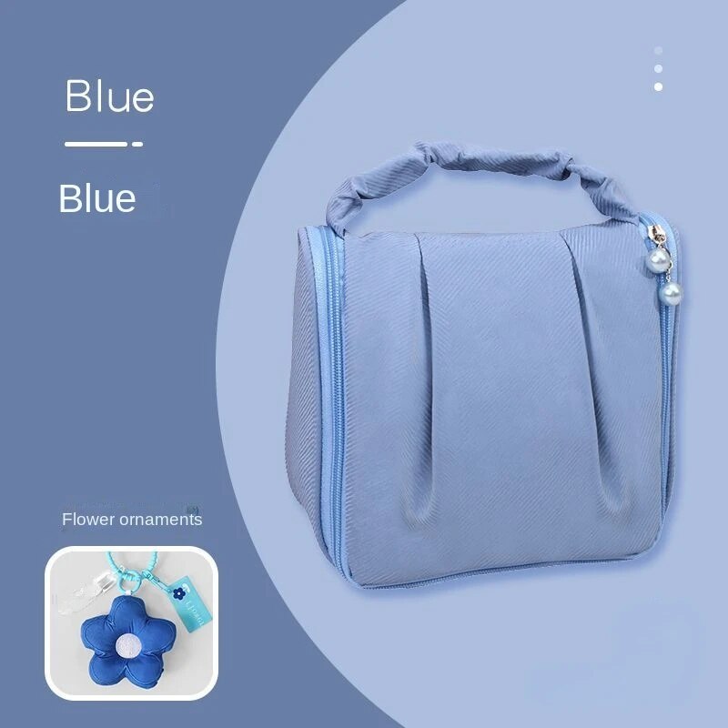 Blue hanging makeup bag with flower ornament pendant and beaded side charm