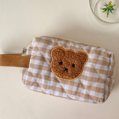 Gingham teddy bear cosmetics bag with brown bear face applique on side