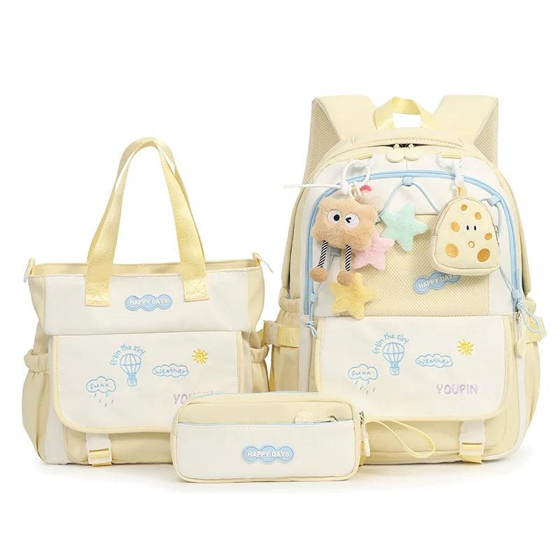 Yellow kids backpack set with plush charm, front pocket, and matching tote bag