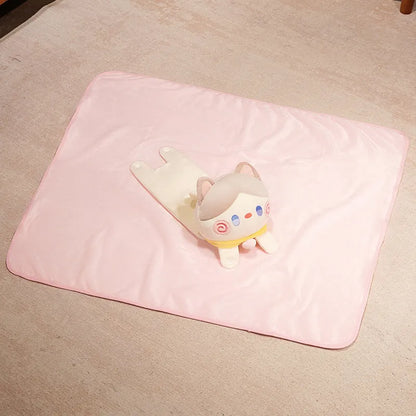 Pink cat pillow blanket with small cat emblem, folded flat blanket view