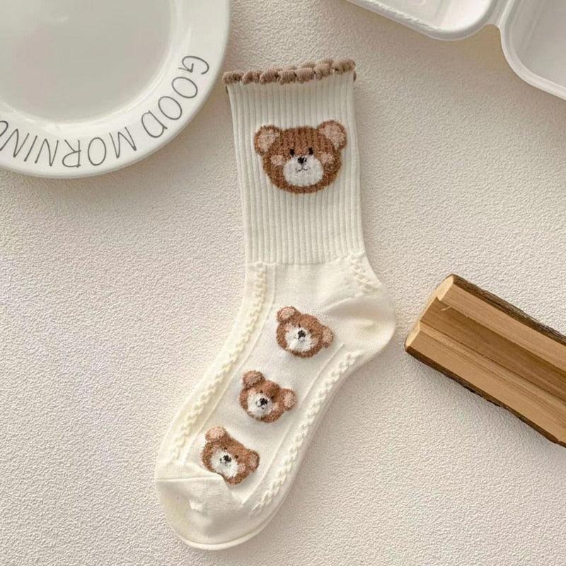 Teddy bear crew socks, white with a brown bear head and three small bear patches