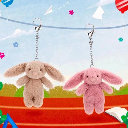Pair of rabbit plush keychains: tan and pink bunnies with silver chain links