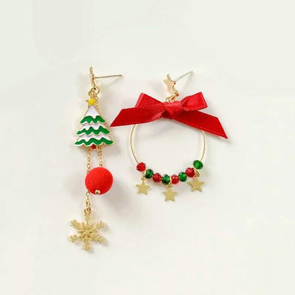 Gold-tone bow and Christmas tree drop earrings with stars and red pom ball dangle