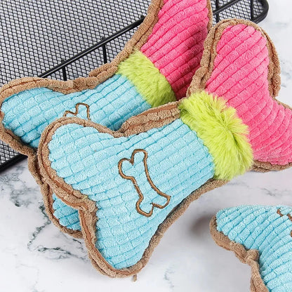Plush bone chew toy set, blue and pink versions with green stripe, brown trim.