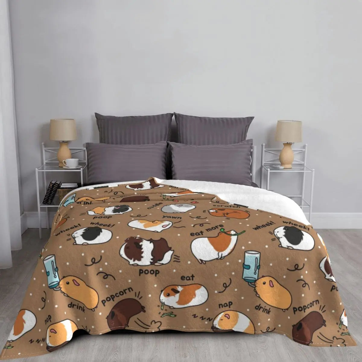 Brown guinea pig throw blanket with cute guinea pig icons, neatly spread on bed