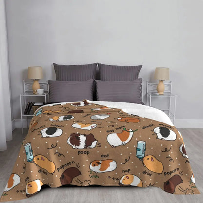 Brown guinea pig throw blanket with cute guinea pig icons, neatly spread on bed